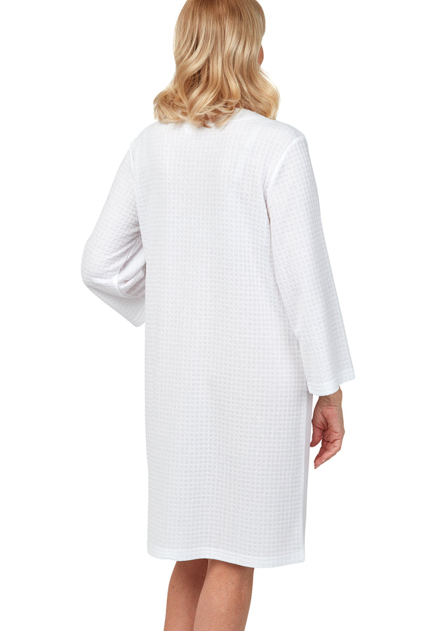 Marlon white easy-care polyester waffle knitted housecoat. Zip front and 2 patch pockets. Cover-up, dressing gown, lounger. Back view photograph on model