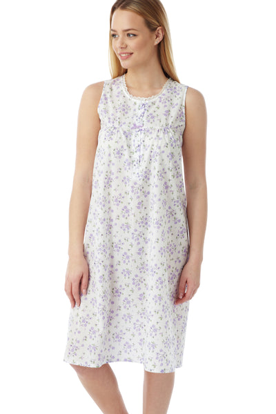Marlon Hazel woven easy care polyester cotton lilac floral sprig print sleeveless classic nightdress with short placket, gathers from yoke seam and lace trim. Photograph on model
