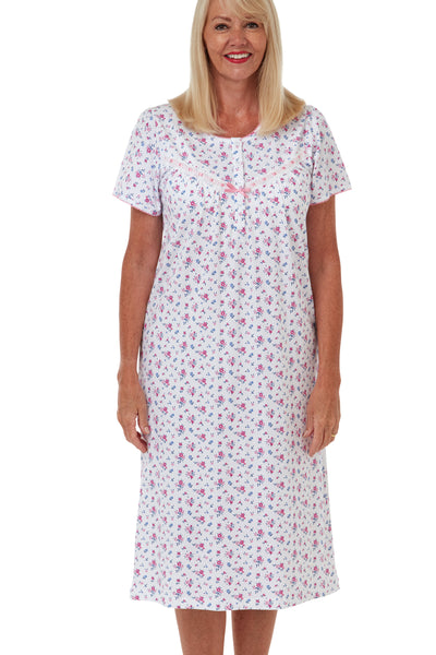 Marlon Maria 100% pure knitted cotton jersey pink floral printed short sleeved classic traditional nightdress with short button placket, gathers from the yoke seam and ribbon slot trim. Photograph on model